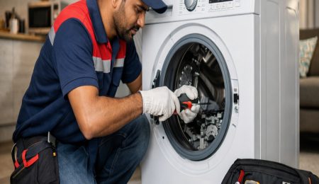 same-day washing machine repair in Hyderabad technician repairing front load washer